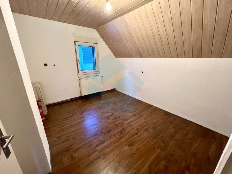 Schlafzimmer 2 OG Einfamilienhaus Butzbach / Hoch-Weisel